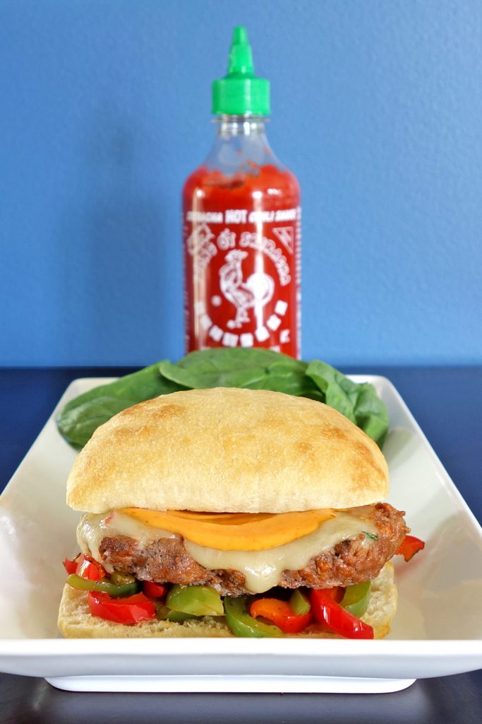 The Rooster Sriracha Burger has stir fried veggies, Sriracha marinated meat, and rooster mayo. This rooster will wake you right up!