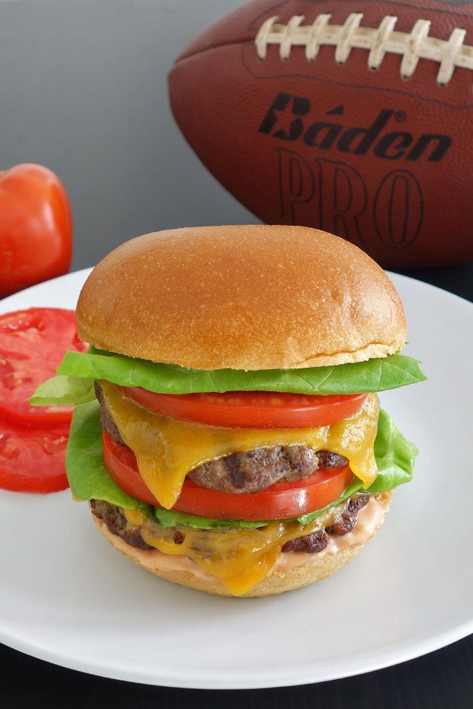 The outstanding double California burger, topped off with fresh lettuce and tomato slices. Perfect for the big game!